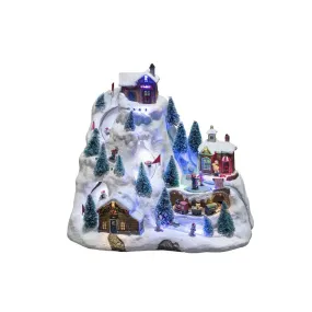 Decoración Navideña Mecánica Con Paisaje Montañoso 28cm Multicolor De Konstsmide - La escena de la monta&ntilde;a cubierta de nieve se ilumina con hermosas luces LED, detalles en movimiento y reproduce 8 canciones navide&ntilde;as cl&aacute;sicas.