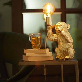 Monkey 23cm Oro lámpara de mesa De Light & Living - El mono detallado con óptica dorada sostiene la bombilla y proporciona una iluminación divertida pero elegante.