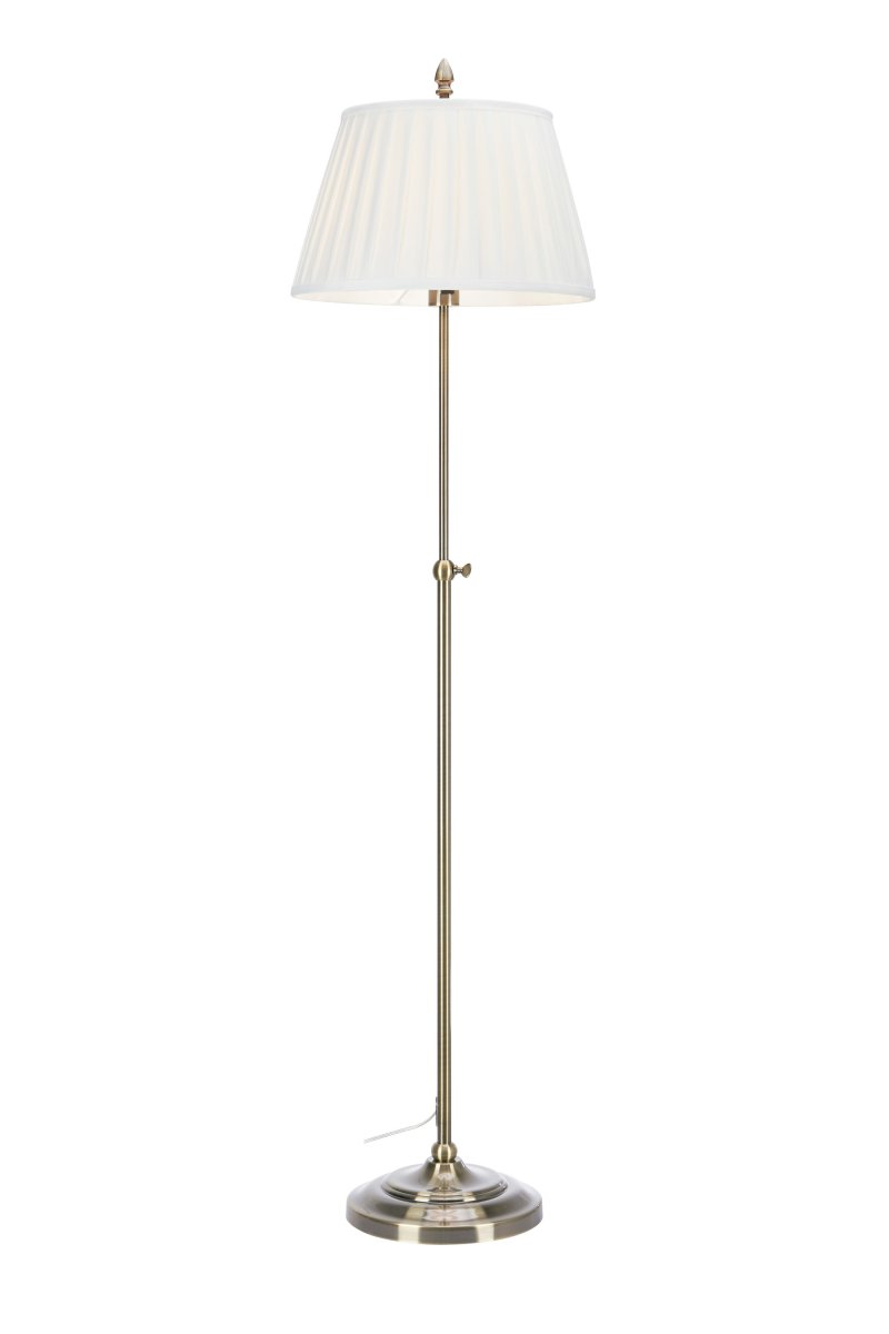 Oxford latón antiguo lámpara de pie De Markslöjd - Lámpara de pie clásica de principios del siglo XX con pantalla de tela color crema y base con efecto latón envejecido.