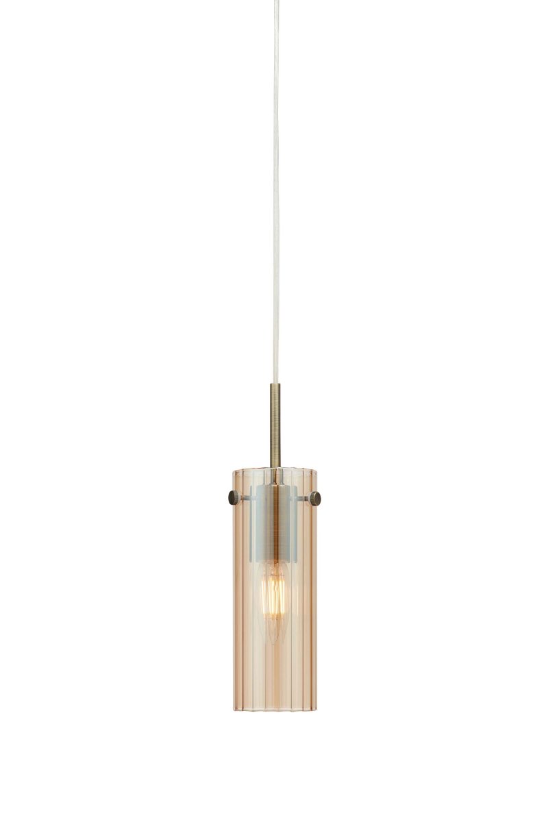 Tibia Ø7 Ámbar/latón lámpara de ventana De Markslöjd - Lámpara cilíndrica de cristal ámbar acanalado con elegantes detalles de latón: un diseño cálido y decorativo que crea una luz suave y ambiental en la ventana.