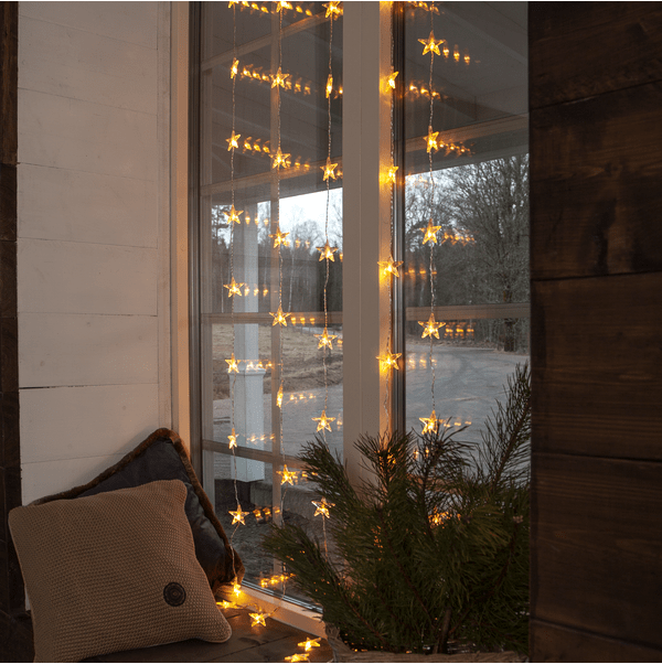 Cortina De Luces Star 2m Transparente De Star Trading - La cortina de estrellas cuenta con 50 fuentes de luz LED y un cable transparente de 3 m de largo con enchufe.