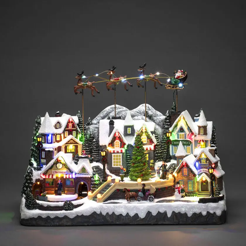 Decoración Navideña Mecánica Con Pueblo Y Tren 40cm Multicolor De Konstsmide - Un magn&iacute;fico pueblo navide&ntilde;o con piezas m&oacute;viles, trenes coloridos y 52 brillantes luces LED que iluminan cada detalle.