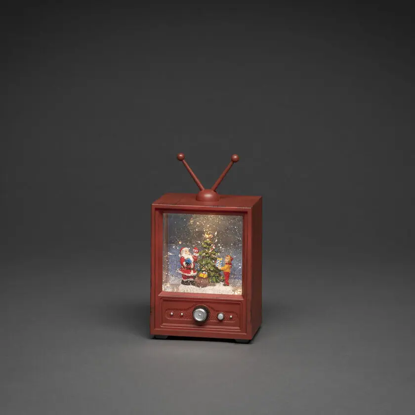 Linterna Rellena De Agua Con Forma De Televisor Marrón De Konstsmide - Esta linterna llena de agua con forma de televisor retro muestra una escena atmosf&eacute;rica con Pap&aacute; Noel, un ni&ntilde;o y un &aacute;rbol de Navidad decorado.