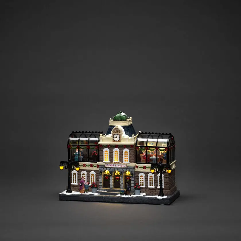 Decoración Navideña Mecánica Con Estación De Tren 25cm Multicolor De Konstsmide - Gran estaci&oacute;n de tren con figuras en movimiento, 15 luces LED de color blanco c&aacute;lido y m&uacute;sica navide&ntilde;a integrada que da vida a tu pueblo navide&ntilde;o.