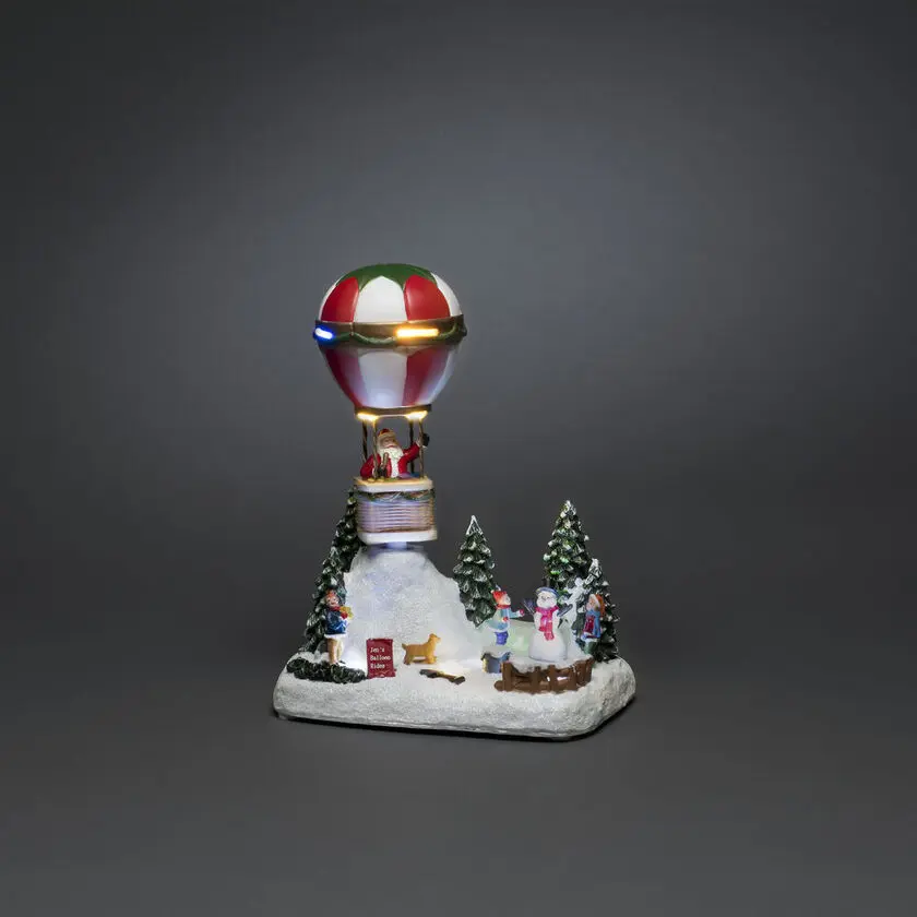 Decoración Navideña Mecánica Con Globo Aerostático Multicolor De Konstsmide - Sum&eacute;rgete en el esp&iacute;ritu navide&ntilde;o con esta imaginativa decoraci&oacute;n mec&aacute;nica de Navidad: &iexcl;un globo aerost&aacute;tico con Pap&aacute; Noel flotando sobre un paisaje invernal!
