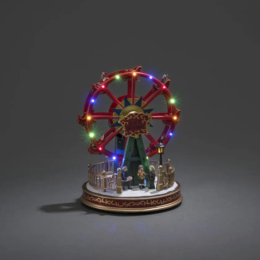 Decoración Navideña Mecánica Con Noria 30cm Multicolor De Konstsmide - Las luces LED de colores y las piezas m&oacute;viles dan vida a la escena festiva de los alegres juerguistas invernales.