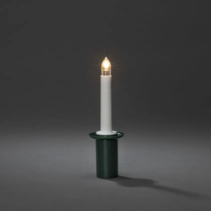 Vela Para Lucía Verde De Konstsmide - Elegante torre de luz con casquillo verde y luz LED que emite una luz blanca suave y cálida.