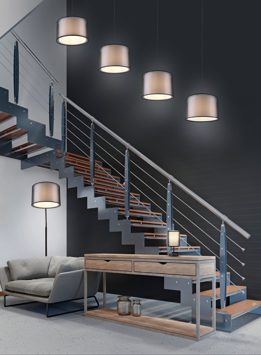 Burton Negro lámpara de pie De Trio Lighting - La moderna combinación de una pantalla interior de tela blanca y una pantalla exterior de plástico negro transparente parece individual y refrescante al mismo tiempo y se puede integrar en espacios habitables modernos.