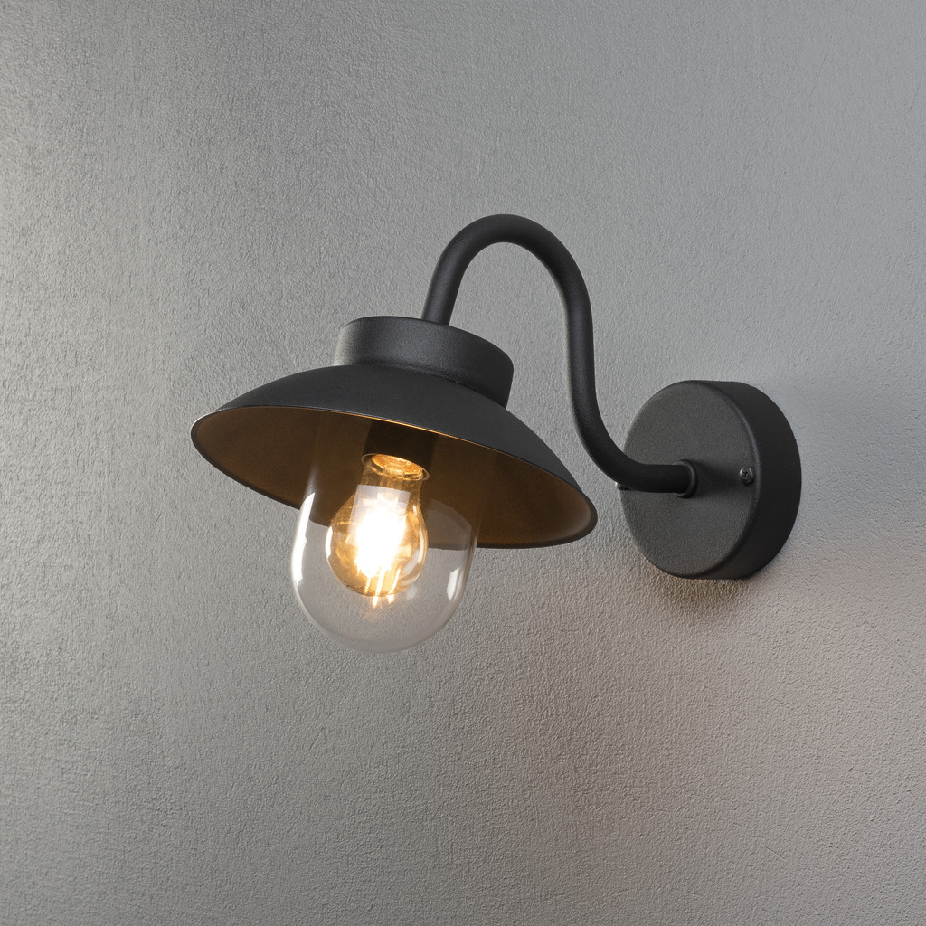 Vega Negro lámpara de exterior De Konstsmide - La pantalla ancha y la cúpula de cristal transparente emiten una luz agradable y dirigida, lo que hace que la lámpara sea perfecta para entradas y patios.