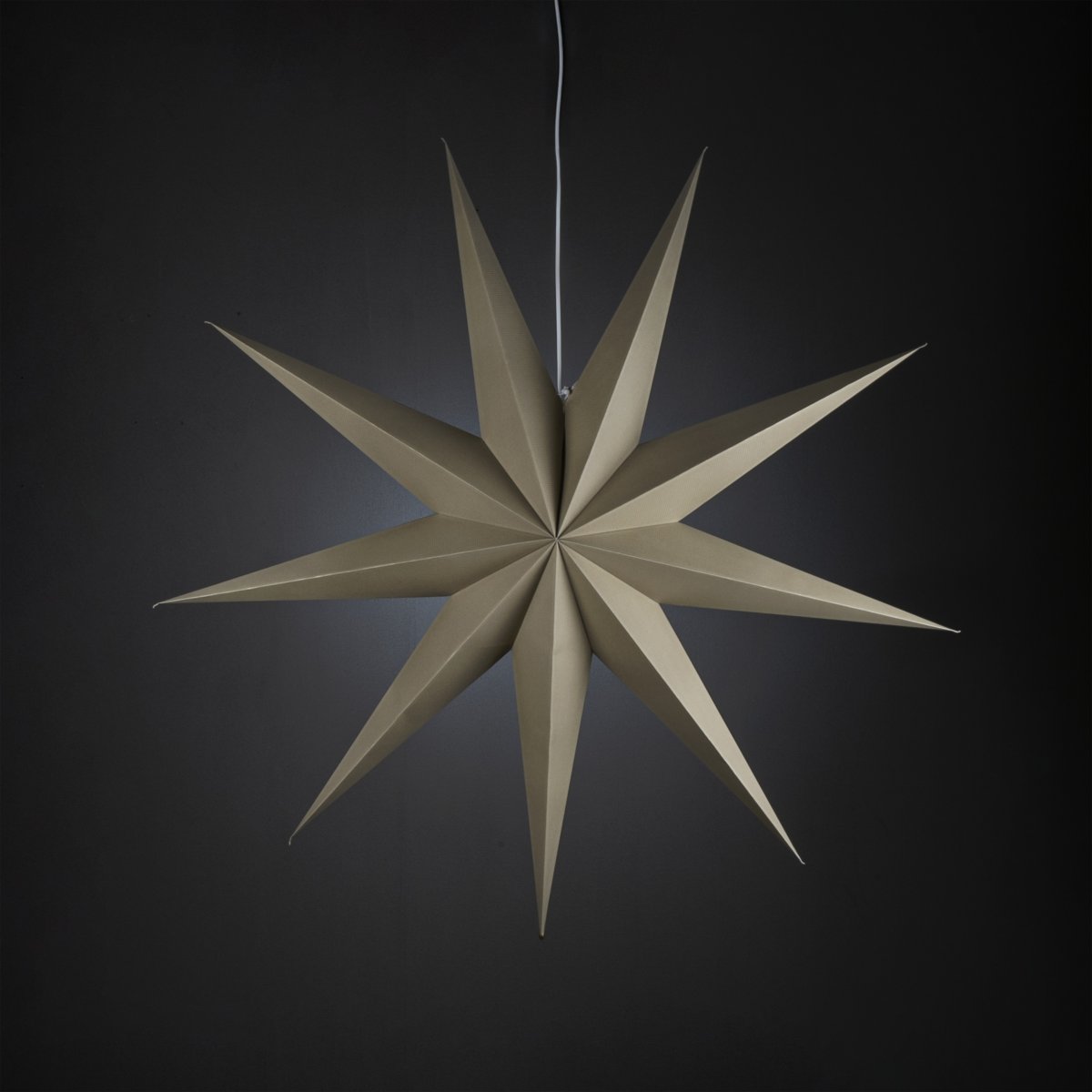 Estrella de papel Ø115 Beige De Konstsmide - Con sus nueve puntas y un generoso di&aacute;metro de 115 cm, se convierte en el centro de atenci&oacute;n de cualquier ventana o habitaci&oacute;n.