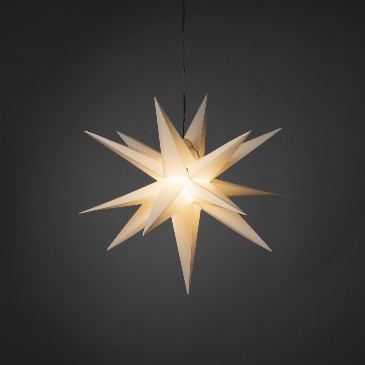 Estrella 3D Ø60 Blanco De Konstsmide - Incluye un casquillo G4, una bombilla LED G4 reemplazable, un cable de pl&aacute;stico negro de 5 metros y un transformador.