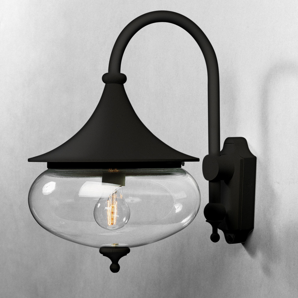 Libra Negro lámpara de exterior De Konstsmide - Las formas suaves y la gran pantalla de cristal transparente difunden una luz cálida y agradable, creando un ambiente acogedor en entradas o terrazas.