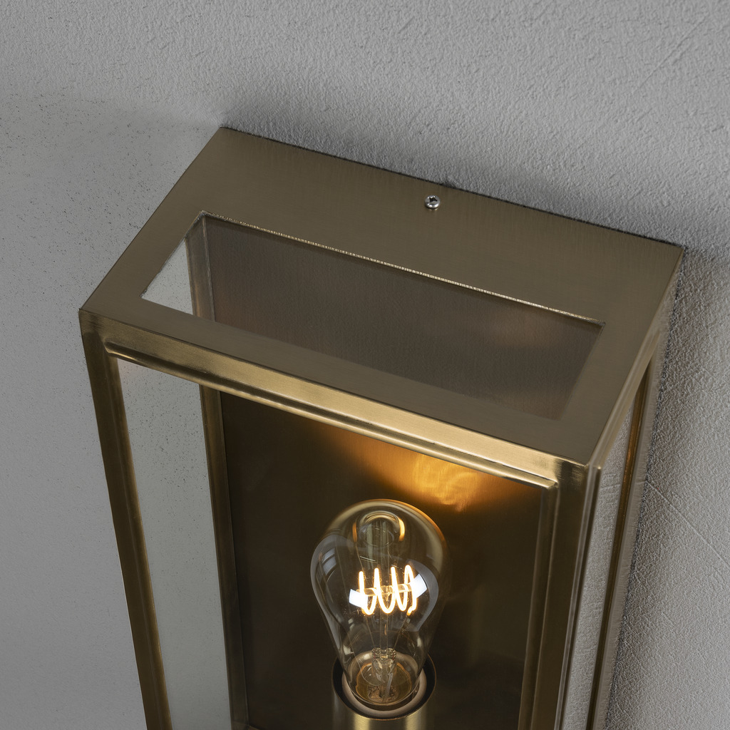 Carpi Latón lámpara de exterior De Konstsmide - Con su carcasa metálica de latón rectangular y abierta, crea un elegante juego de luz que le da a su entorno exterior un aspecto único.