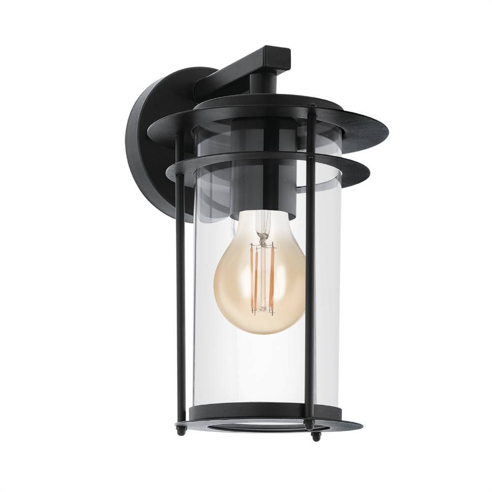 Valdeo Negro lámpara de exterior De Eglo - La l&aacute;mpara presenta un elegante marco de acero galvanizado negro y un cilindro de vidrio transparente que rodea la fuente de luz, proporcionando una iluminaci&oacute;n agradable y acogedora.