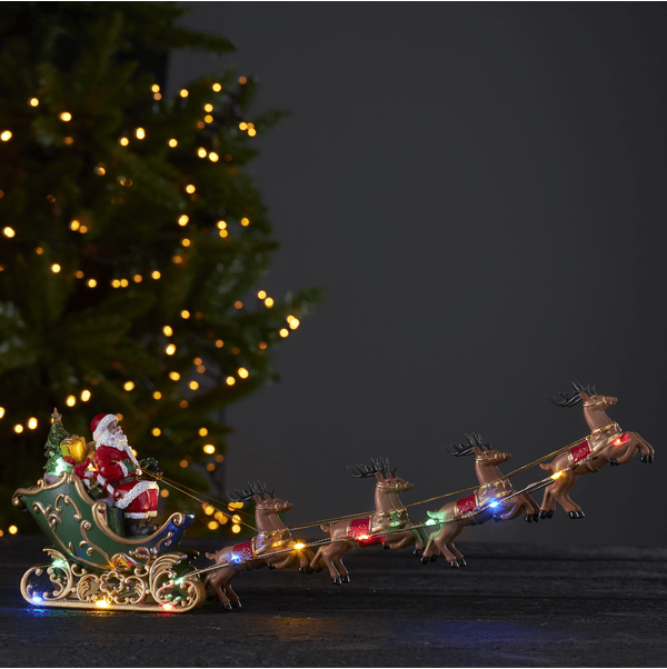 Deerville Multicolor De Star Trading - Figura decorativa con forma de Pap&aacute; Noel con trineo y renos.