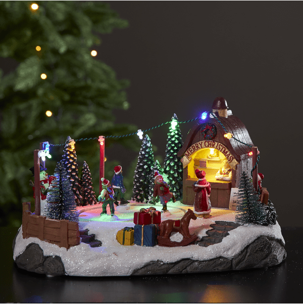 Iceville Multicolor De Star Trading - Una fantástica decoración para Navidad o Adviento: una pequeña pista de hielo giratoria con música.