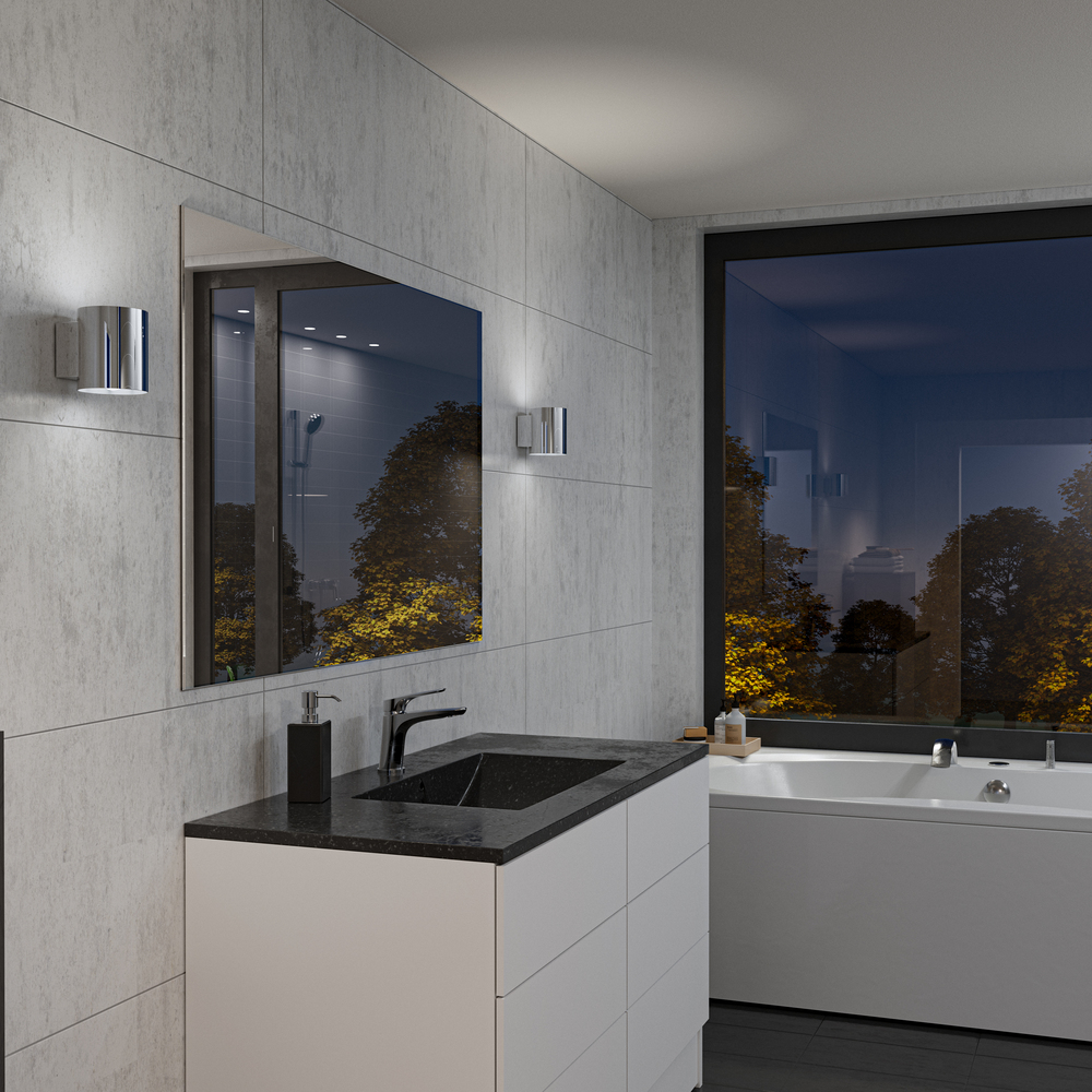 Evoke S Cromo lámpara de pared De Herstal - Den smarta konstruktionen med b&aring;de upp- och nerljus g&ouml;r den till ett utm&auml;rkt val f&ouml;r att belysa din hall, vardagsrum eller sovrum p&aring; ett subtilt men effektfullt s&auml;tt.