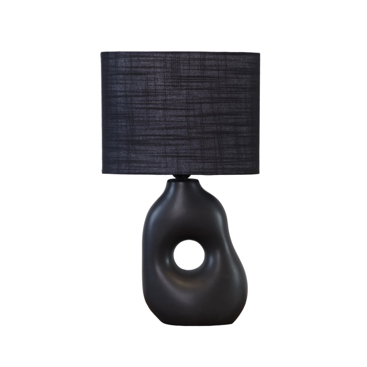 Pikazo 45cm Negro lámpara de mesa De Lampan - La lámpara de mesa Pikazo negra cautiva con su exclusiva base de cerámica escultural, con una perforación decorativa y una pantalla ovalada de lino a juego.