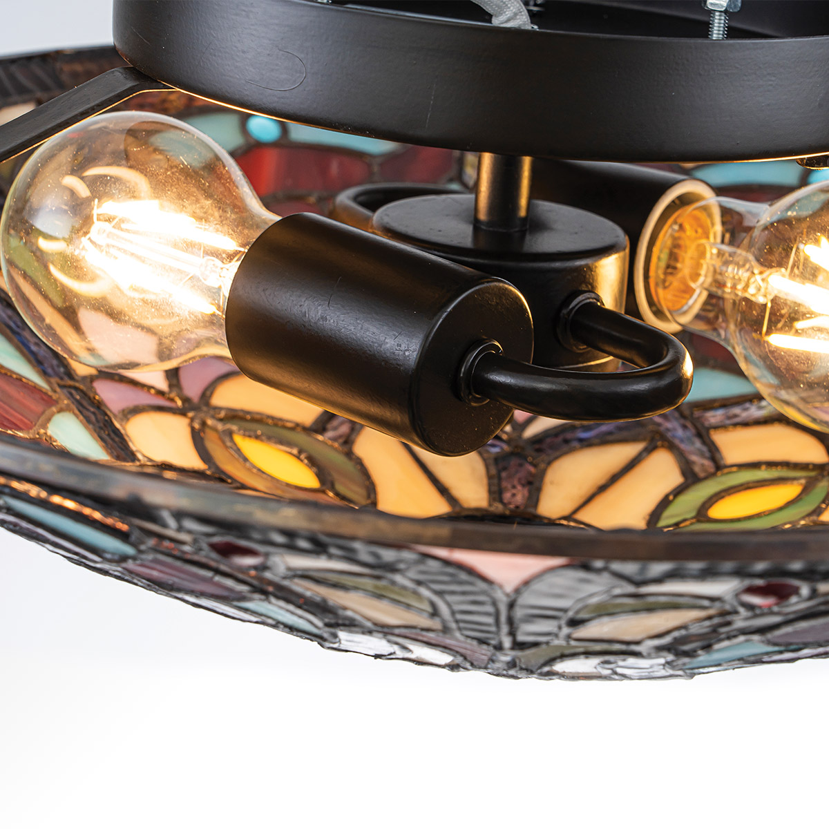 Larissa Ø42 Multicolor De Elstead Lighting - Su pantalla en forma de cuenco está hecha de cristal acrílico de colores en hermosos tonos de rojo, azul, rosa y amarillo, creando un patrón vibrante y lleno de detalles.