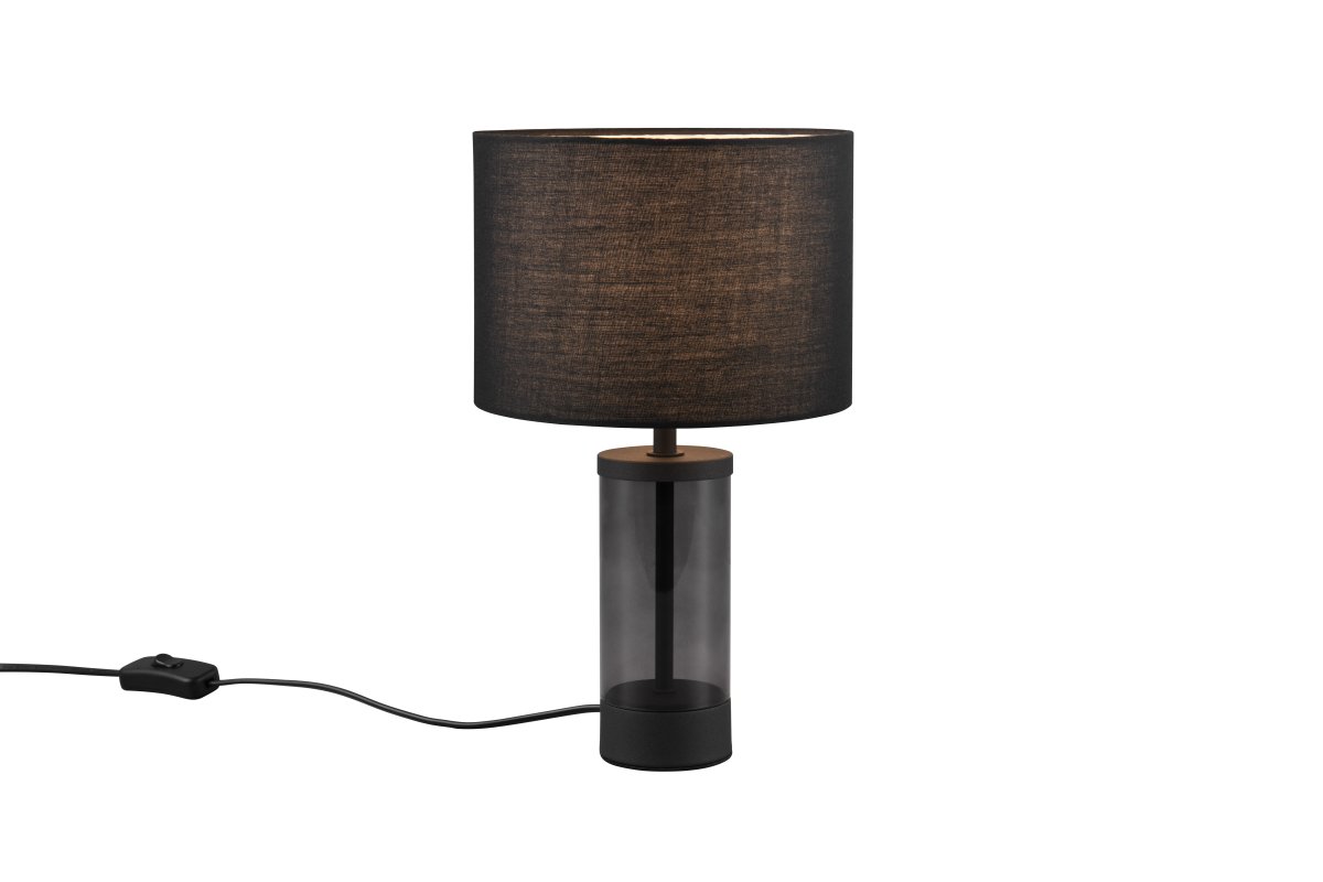 Grazia 34cm Negro lámpara de mesa De Trio Lighting - La lámpara de mesa Grazia combina una elegante pantalla de tela con una elegante base cilíndrica de vidrio y metal, creando una impresión armoniosa y elegante.