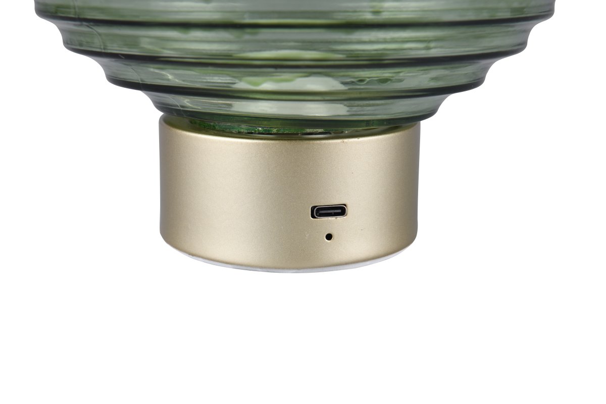 Earl 14cm Verde portátil De Trio Lighting - Ya sea sobre una mesa, un aparador o en un rincón acogedor, la lámpara de mesa EARL, con su elegante diseño, difunde una luz encantadora dondequiera que se coloque.